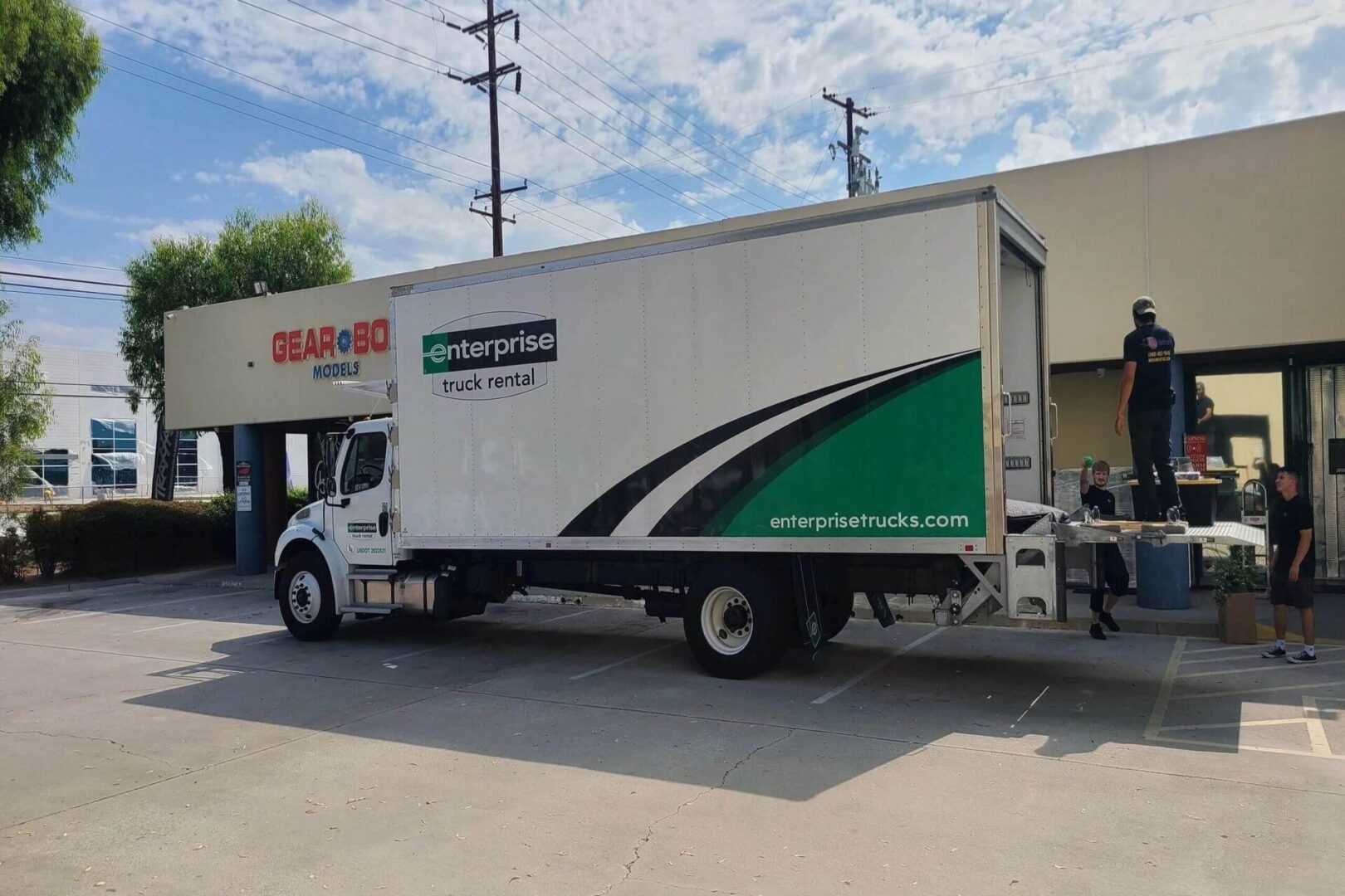 Delivery Boys Standing on the Truck. Ready to Load the Packages