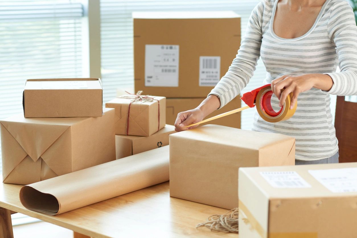 Woman Wrapping Boxes